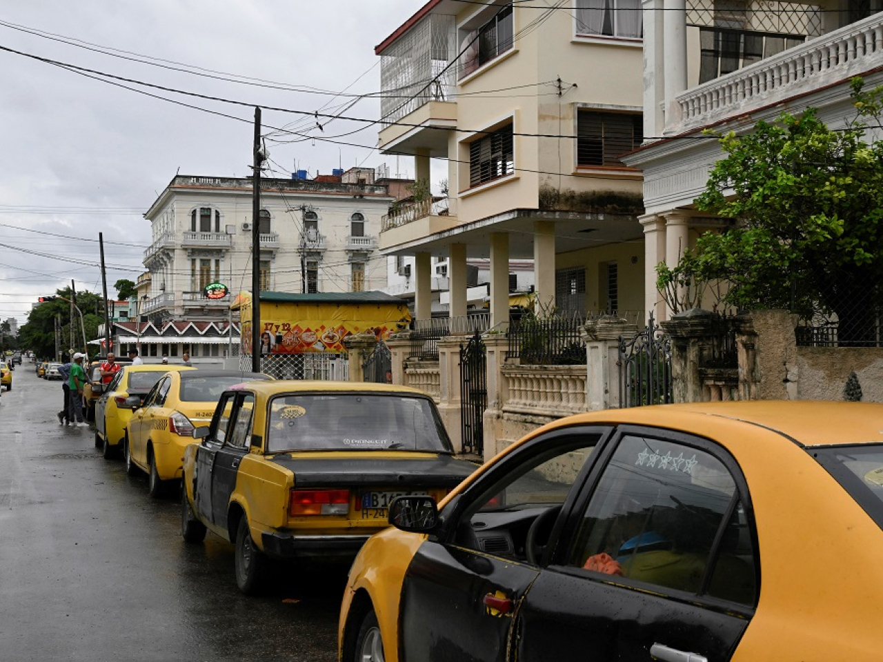 Taxi drivers wait in line for fuel outside a petrol station, after US President Donald Trump vowed to block Venezuelan oil imports. File photo: Reuters