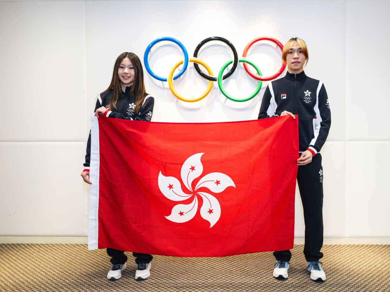 Eloise King, left, and Kwok Tsz-fung are the SAR's flagbearers. Photo courtesy of the Sports Federation & Olympic Committee of Hong Kong, China