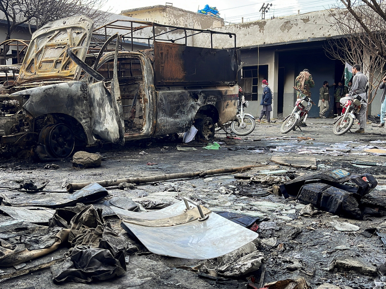 Burnt vehicles clutter the courtyard of a police station in Quetta, Pakistan, following an attack by militants. Photo: Reuters
