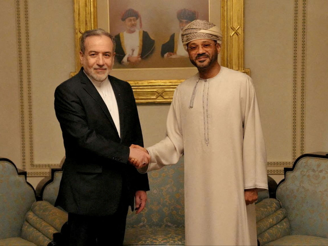 Iranian Foreign Minister Abbas Araqchi (left) shakes hands with Omani Foreign Minister Sayyid Badr Albusaidi in Muscat. Photo: Reuters