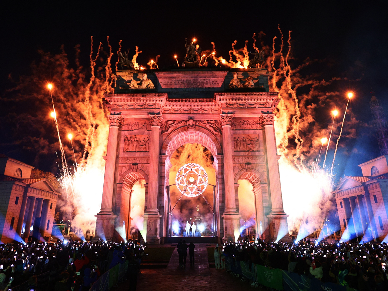 Fireworks are set off after the Olympic cauldron under the Arco della Pace in Milan is lit by Alberto Tomba and Deborah Compagnoni. Photo: Reuters