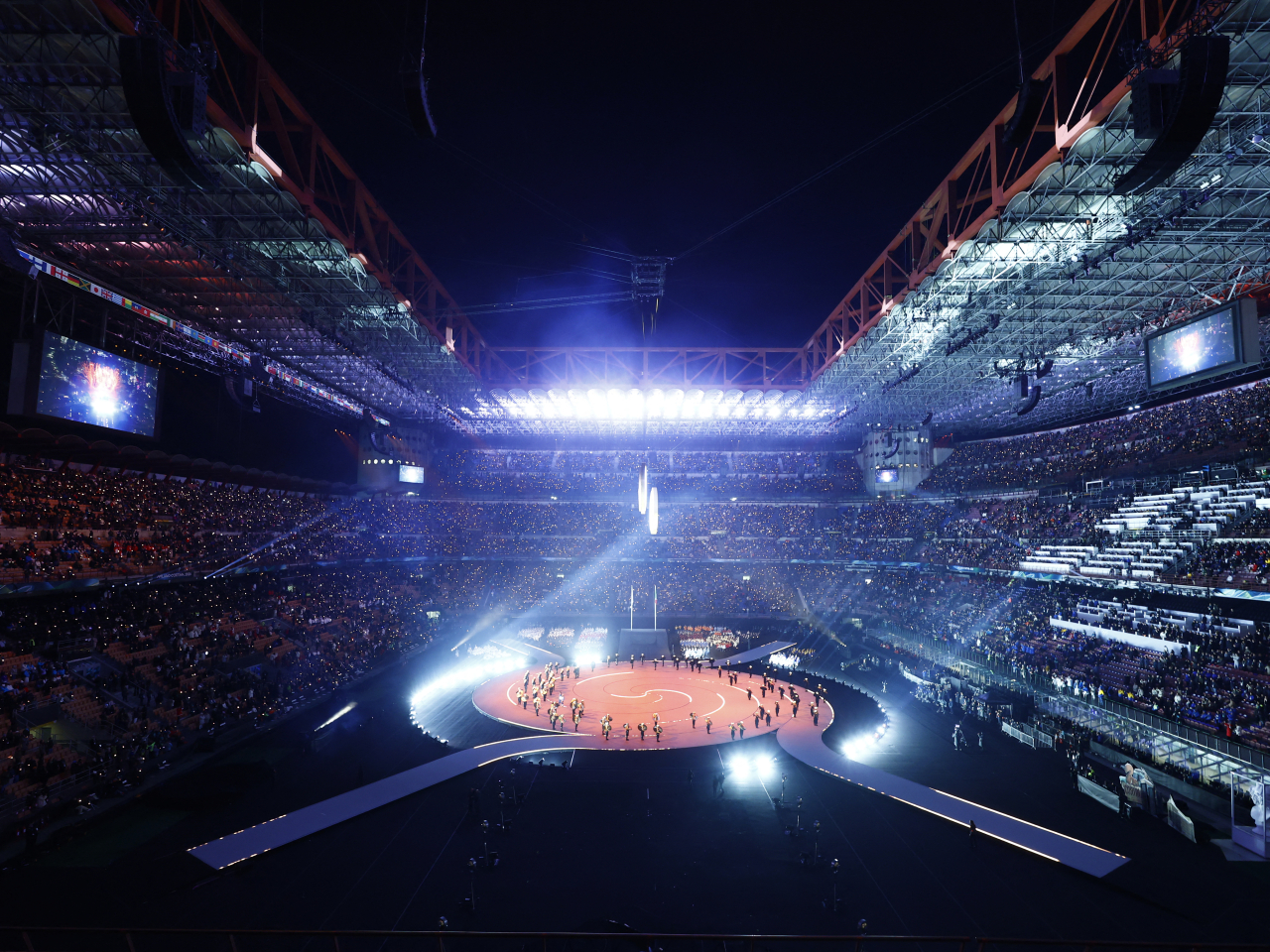 The audience at San Siro Stadium is treated to a slick show as part of the opening ceremony in Milan. Photo: Reuters