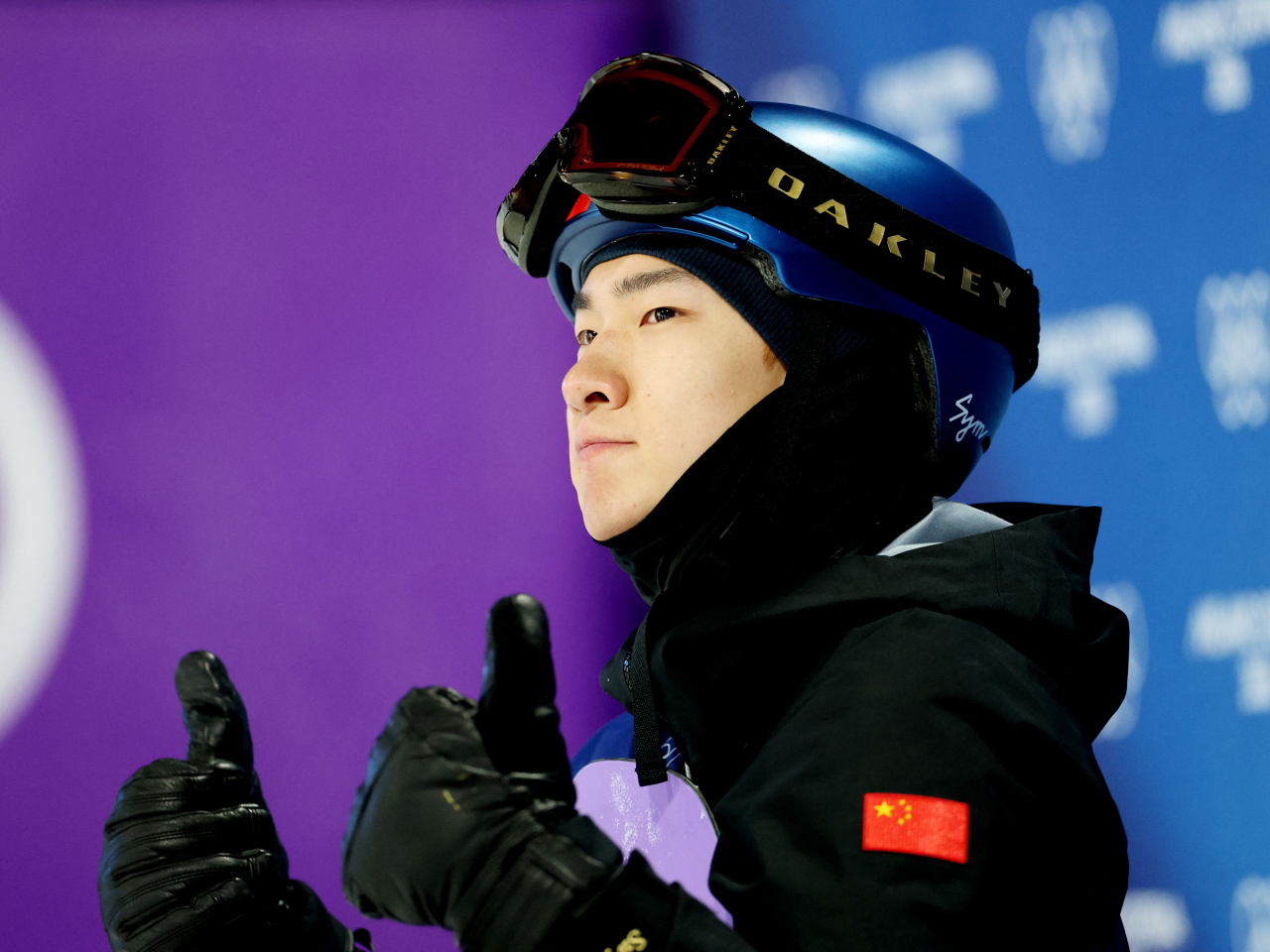 Su Yiming gives two thumbs up after his second run at the Livigno Snow Park. Photo: Reuters