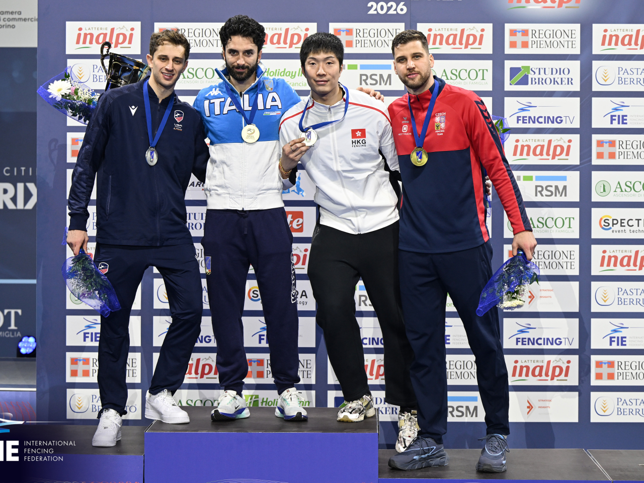 Edgar Cheung, second right, wins a bronze medal at the Grand Prix in Turin. Photo courtesy of International Fencing Federation