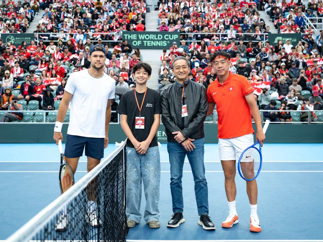 Coleman Wong, right, and Otto Virtanen, left, battle in Sunday's singles match in which Virtanen wins in straight sets, sealing Finland's victory. Photo courtesy of Hong Kong, China Tennis Association