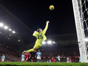Gianluigi Donnarumma's stunning save from Liverpool's Alexis Mac Allister kept City in front in a frantic final few minutes. Photo: Reuters