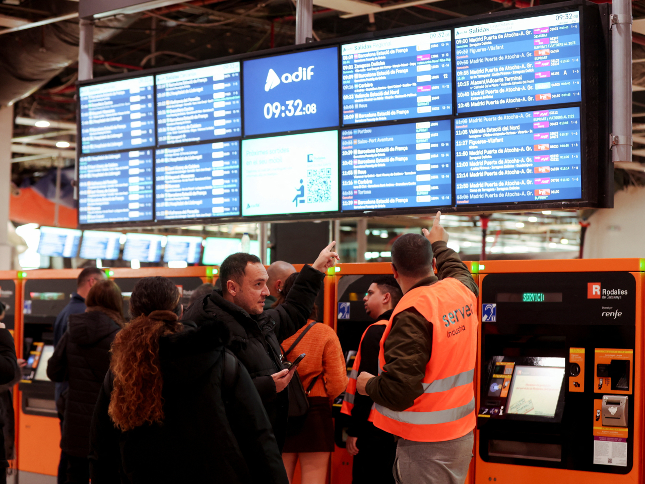 People ask for direction at a train station, amid a national strike by Spain's train drivers' union. Photo: Reuters