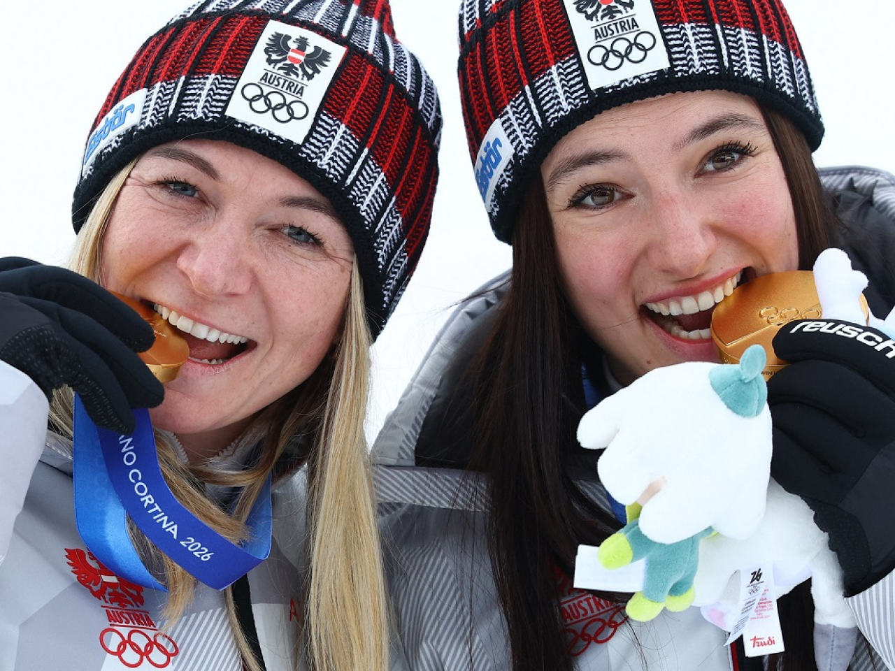 Austrian duo Ariane Raedler and Katharina Huber celebrate winning gold. Photo: Reuters