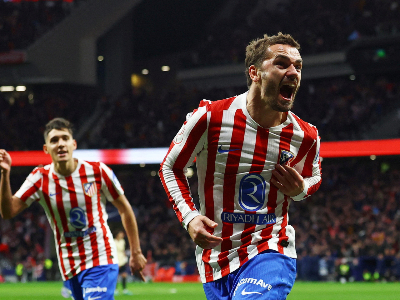 Antoine Griezmann, right, was among the goal-scorers in Atletico's rout of Barca. Photo: Reuters