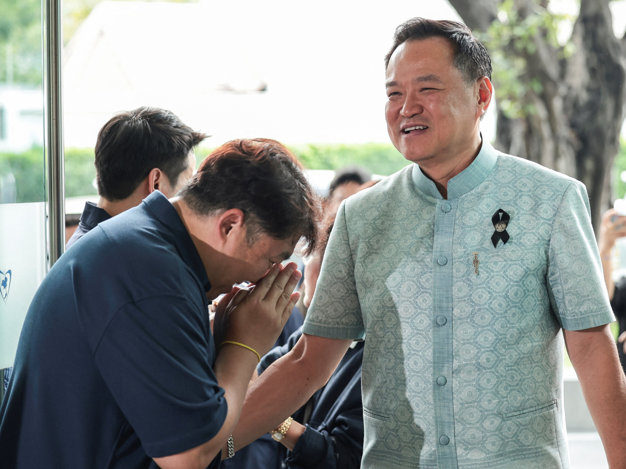 Anutin Charnvirakul arrives at the headquarters of his party in Bangkok for talks amid efforts to forge a ruling coalition. Photo: Reuters