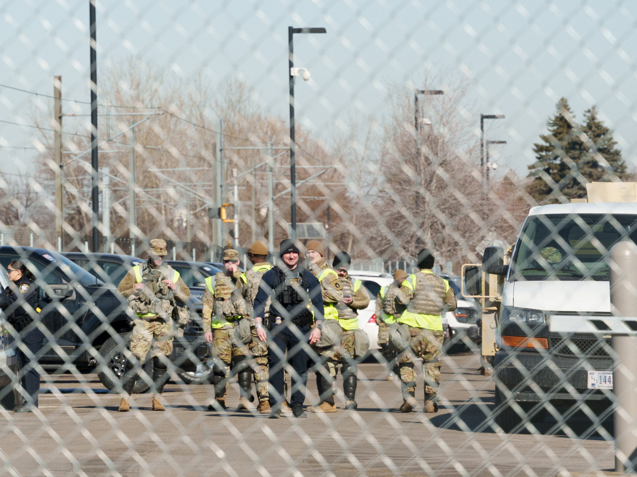Department of Homeland Security agents and National Guardsmen gather in a Minnesota federal building lot following news of the shutdown. Photo: Reuters
