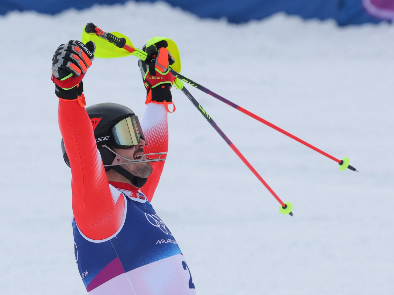Loic Meillard celebrates after adding another gold to the Swiss near-domination of men's alpine skiing at the Winter Olympics. Photo: Reuters