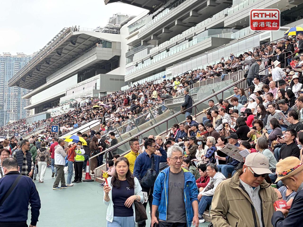 Locals and tourists alike went to Sha Tin Racecourse for the first race day of the Year of the Horse. Photo: RTHK