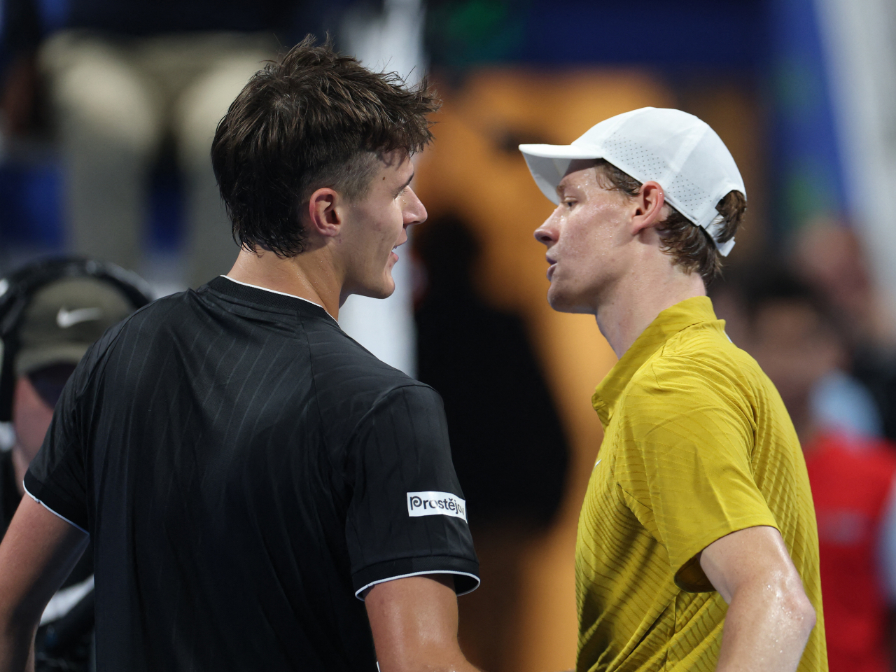 Jakub Mensik, left, is the first player outside the top ten to defeat Jannik Sinner on a hard court since 2023. Photo: Reuters