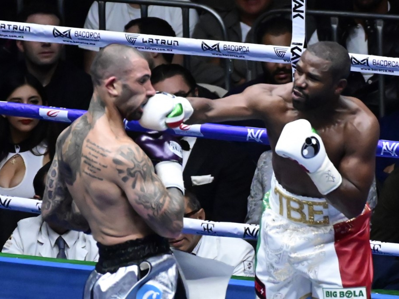 Floyd Mayweather Jr lands a punch on John Gotti III of the United States during an exhibition fight in Mexico City in 2024. Photo: NurPhoto via AFP