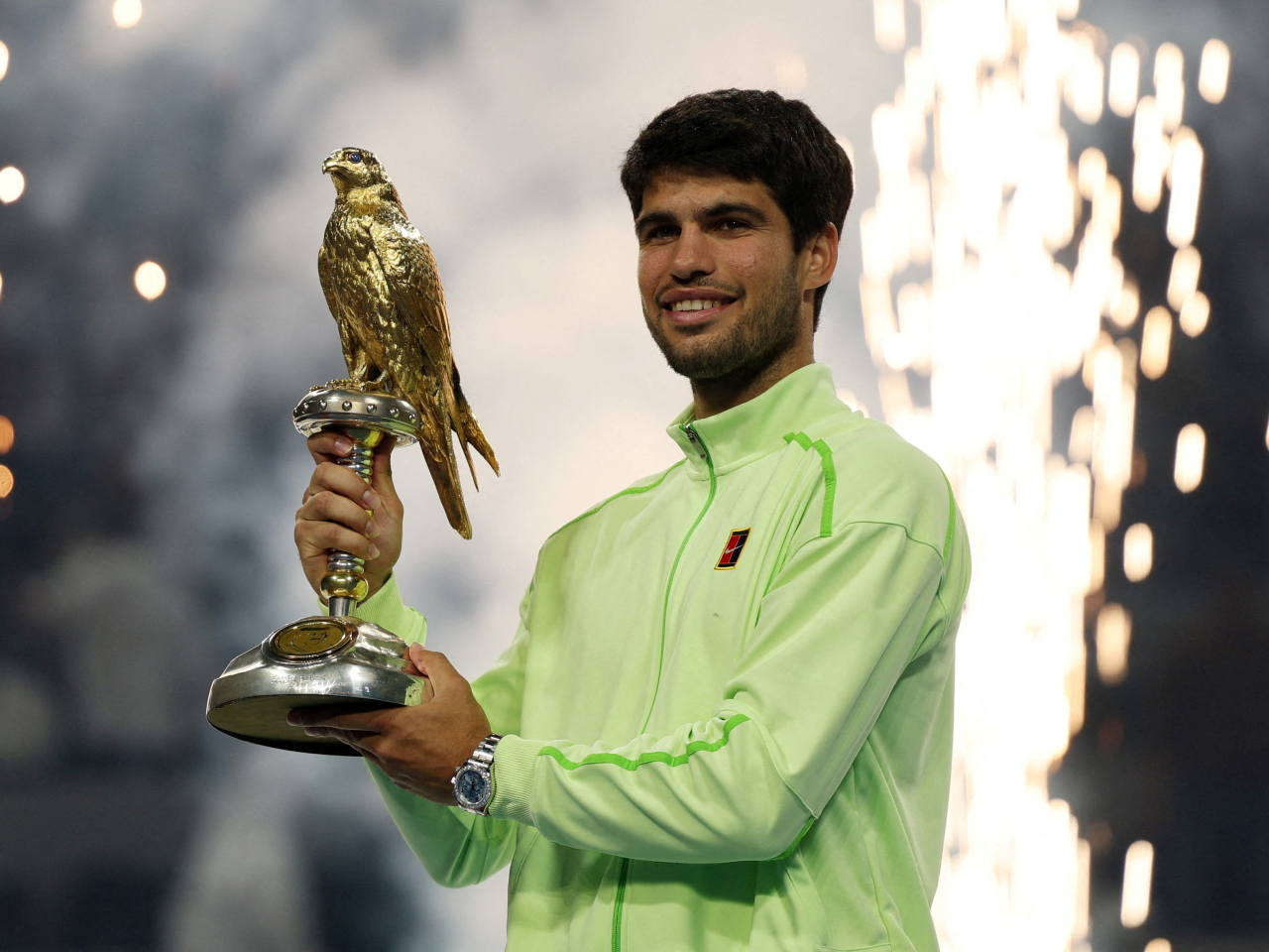 Spain's Carlos Alcaraz celebrates with the Qatar Open trophy after winning the final match against France's Arthur Fils. Photo: Reuters