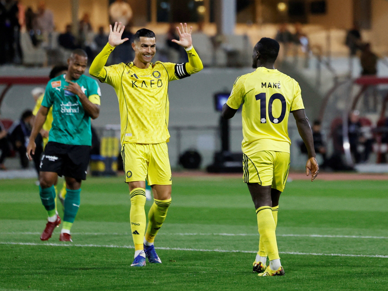 Cristiano Ronaldo celebrates with Sadio Mane after the winger scores Al-Nassr's fourth goal on the way to a 5-0 away win against Al-Najma in Jeddah. Photo: Reuters