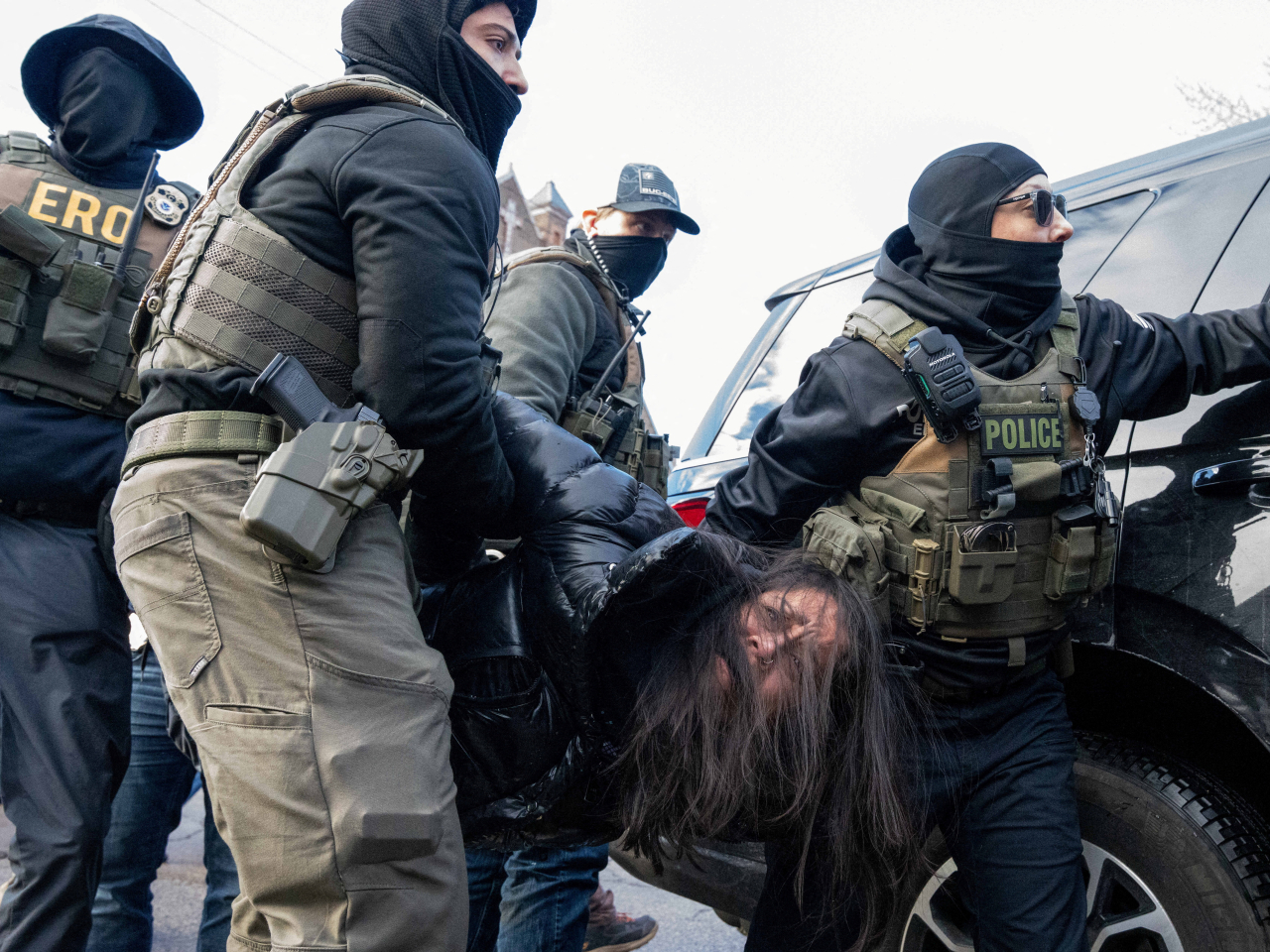 An activist is carried off by federal agents following an immigration raid that led to the detainment of two Hispanic youths in Minneapolis, Minnesota. File photo: Reuters