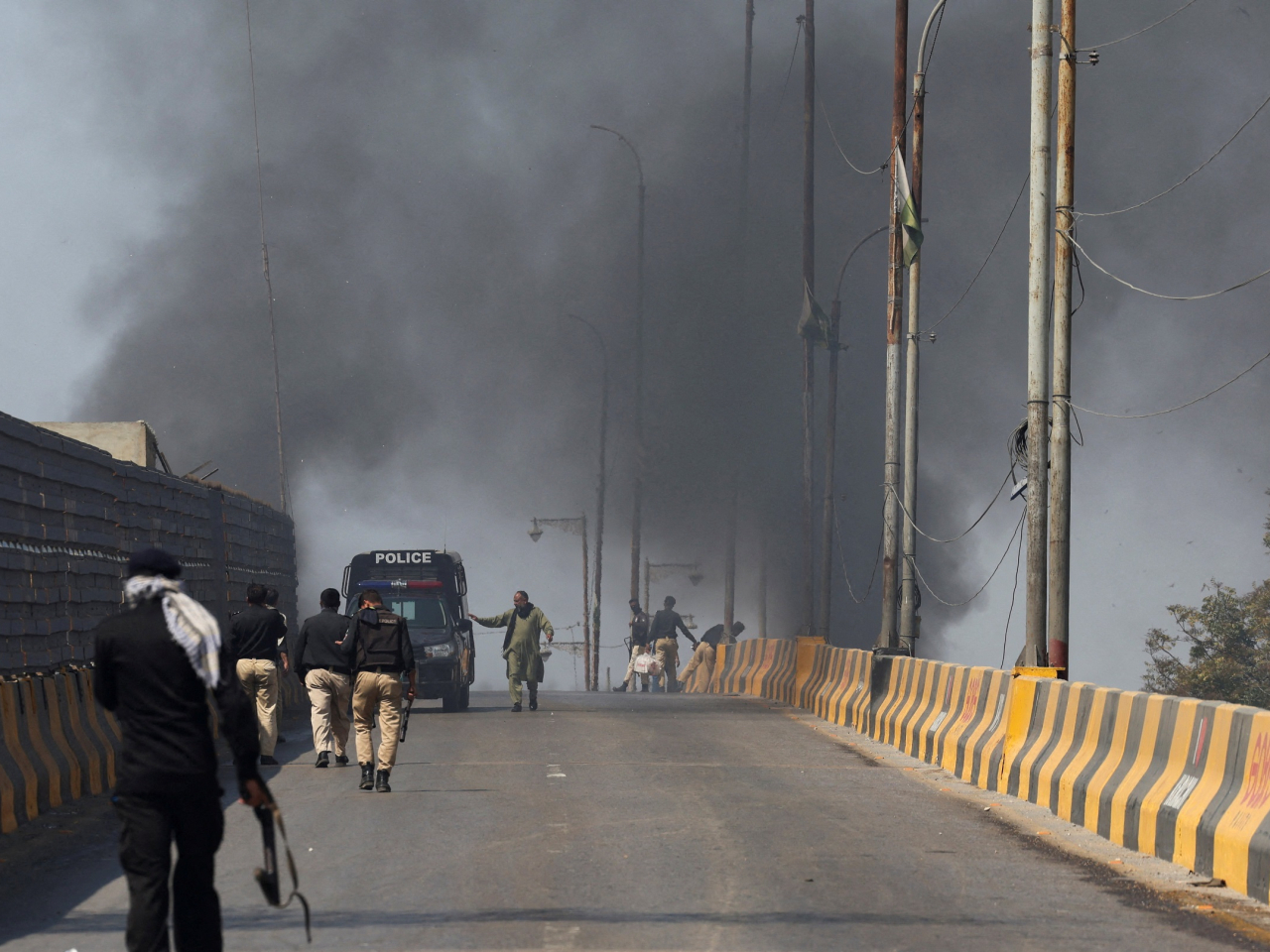 Smoke billows near the US Consulate in Karachi amid protests against military action by the US and Israel against Iran. Photo: Reuters