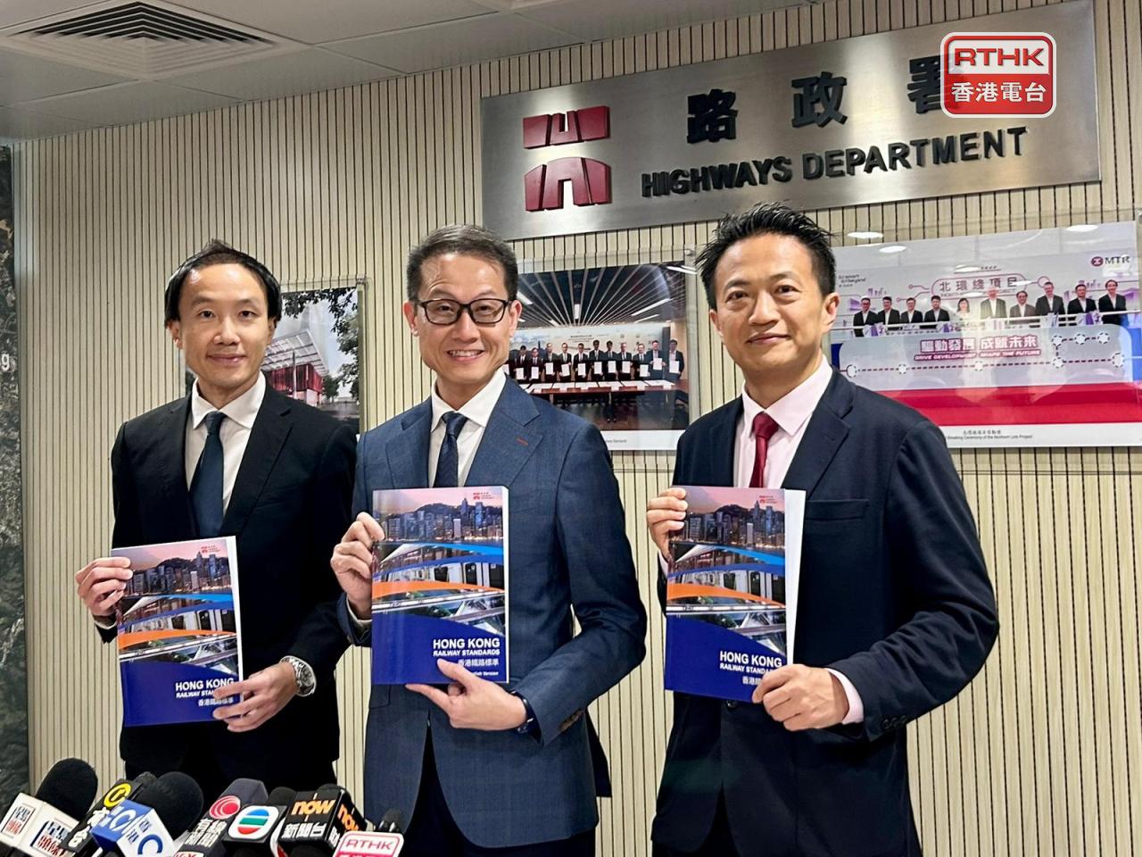 Raymond Ip, left, says the adoption of mainland and overseas experience will not affect existing safety standards. File photo: RTHK