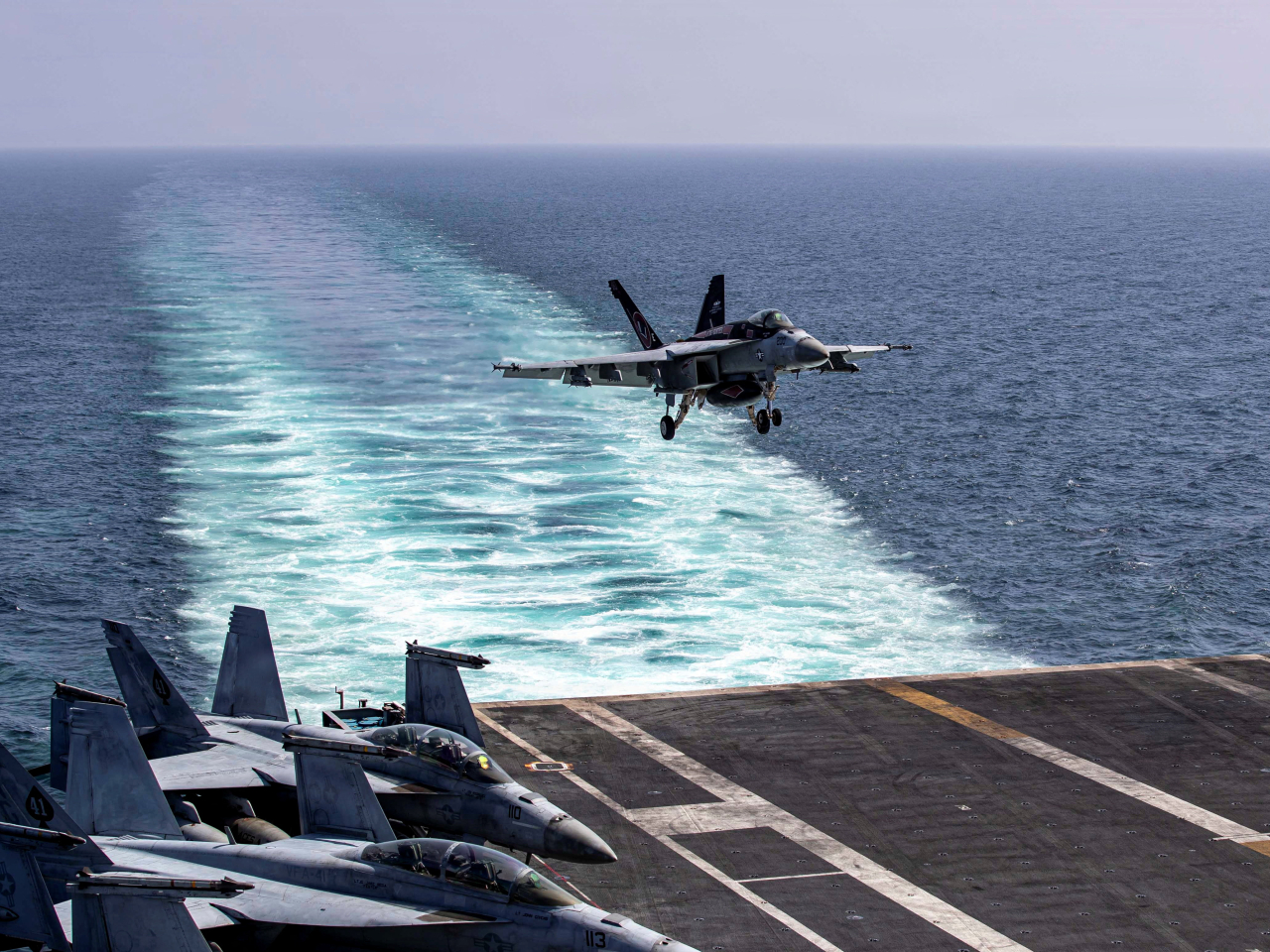 An F/A-18E Super Hornet makes an arrested landing on the flight deck of the USS Abraham Lincoln in support of the attack on Iran. Photo: Reuters