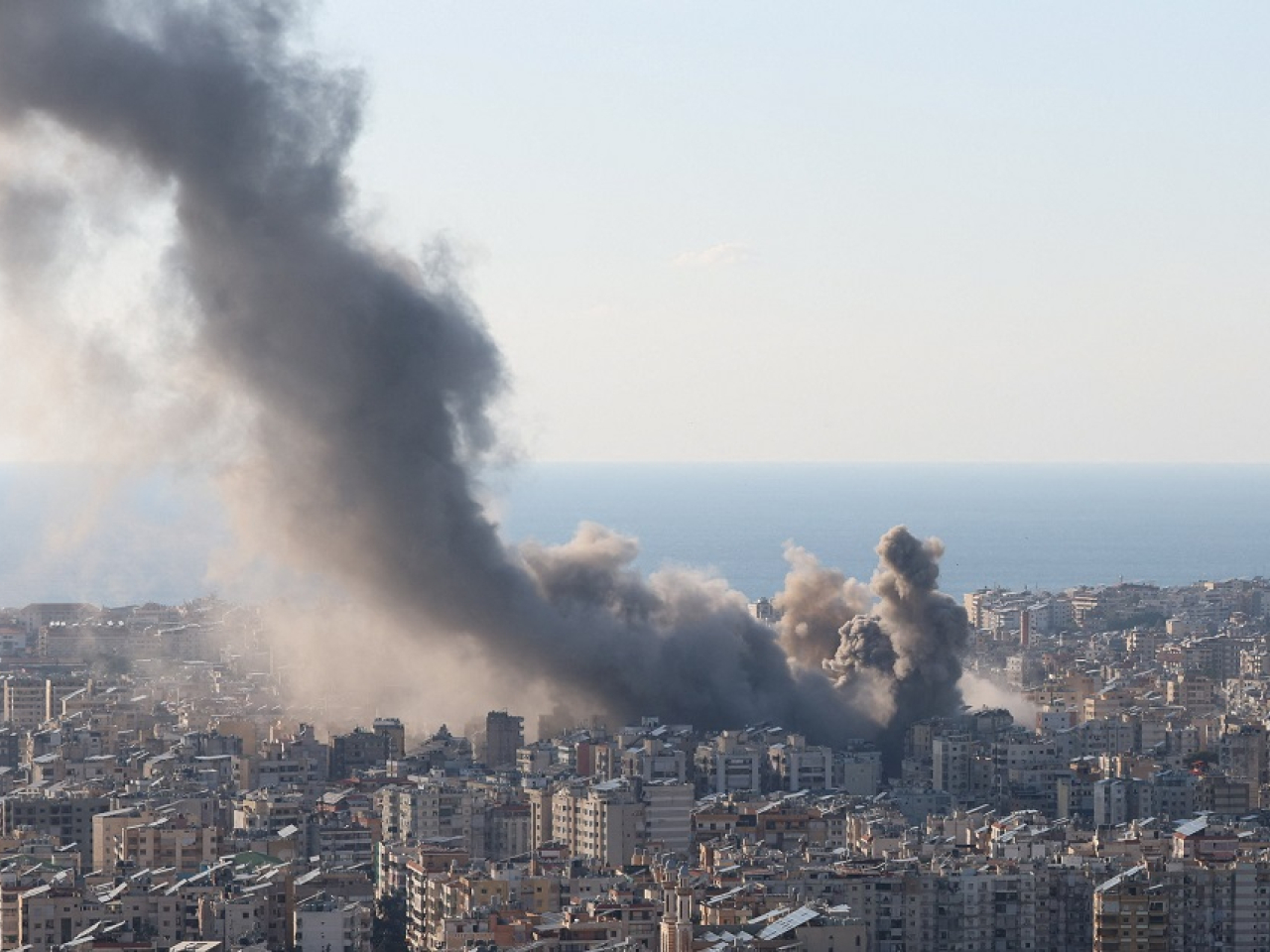 Smoke and dust rise after an Israeli strike on Beirut's southern suburbs. Photo: Reuters