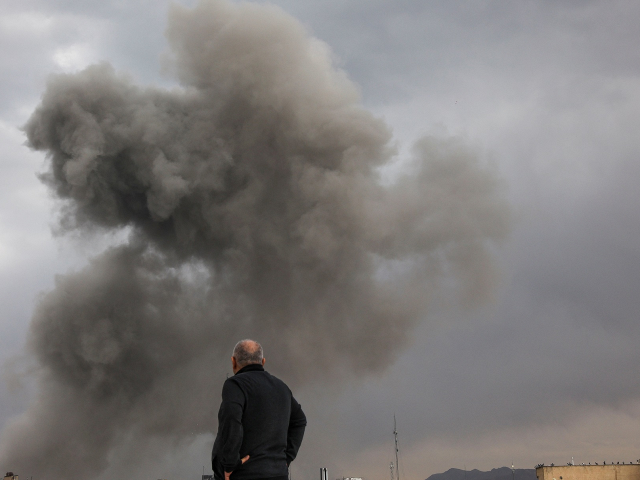 Smoke rises following an explosion in Tehran after the US and Israel launch strikes on Iran. Photo: Majid Asgaripour/West Asia News Agency via Reuters