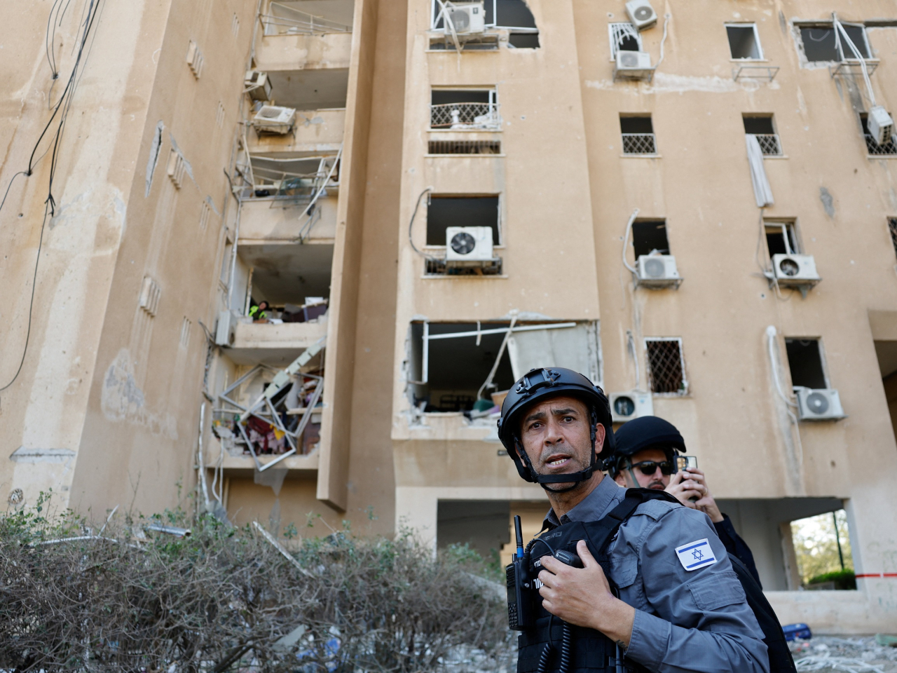 Emergency responders attend the scene of an Iranian missile strike in Beersheba, southern Israel. Photo: Reuters