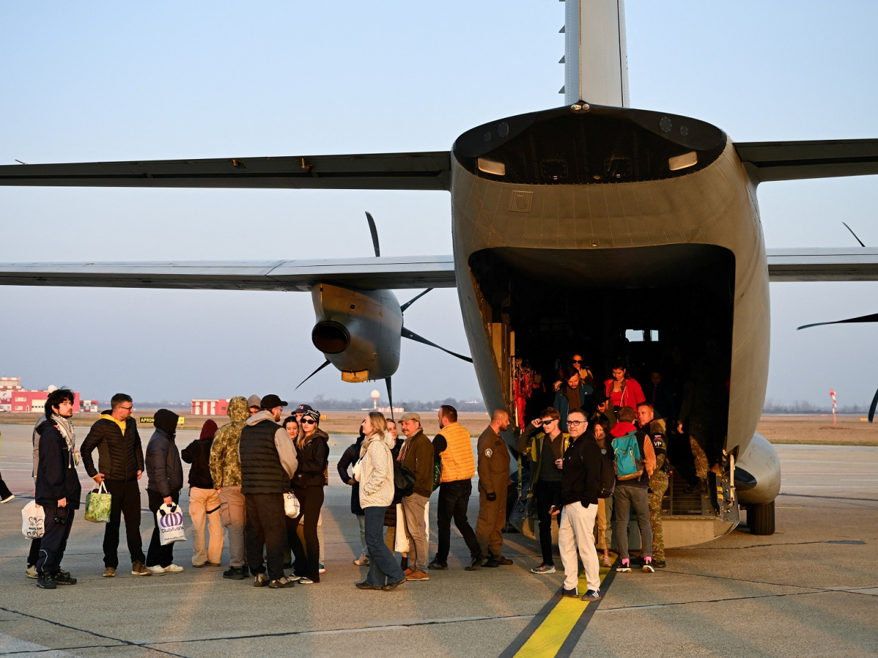 Repatriated Slovaks who were stranded in Jordan amid the US-Israel conflict with Iran arrive at MR Stefanik Airport in Bratislava. Photo: Reuters