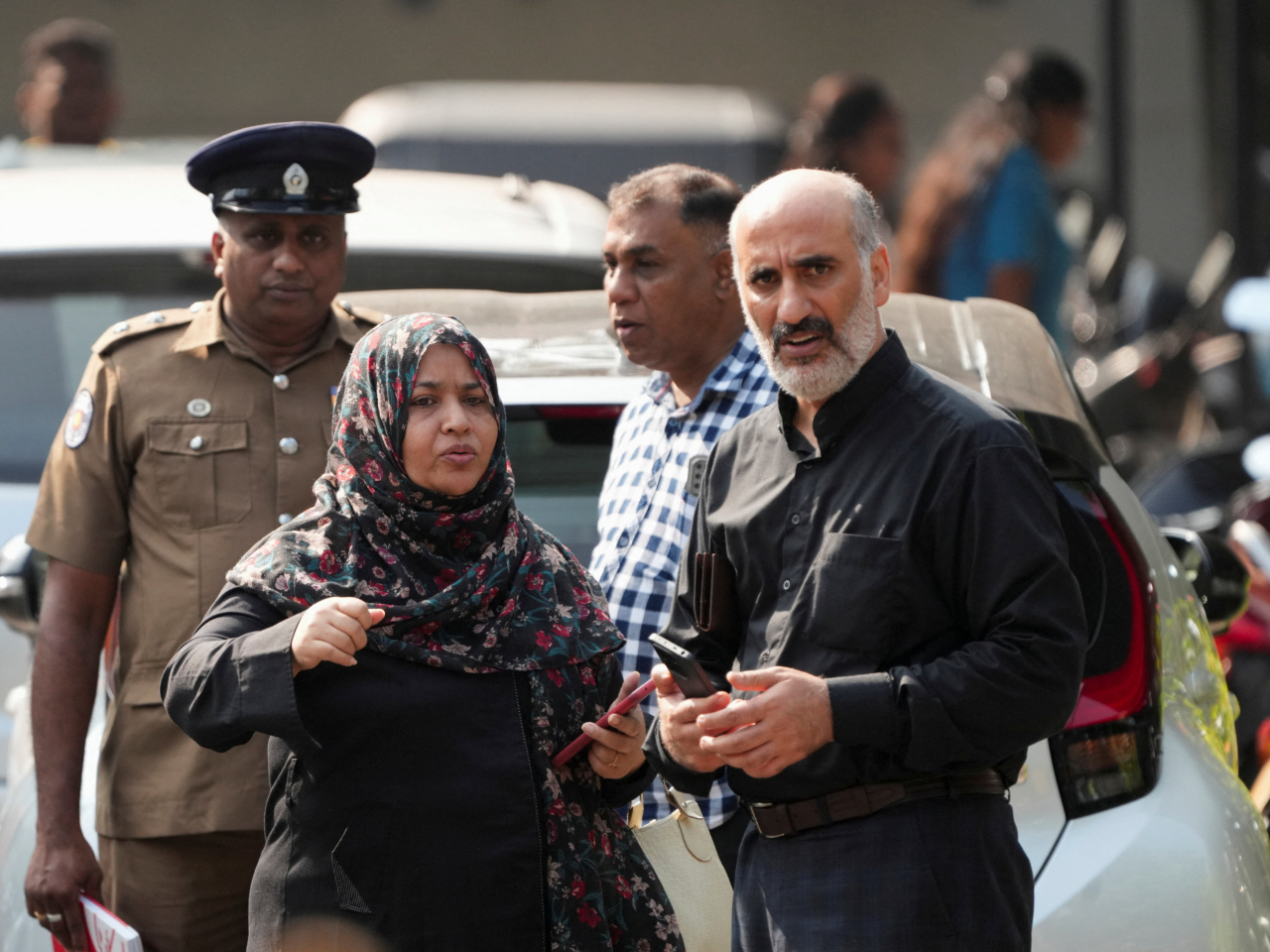 An Iranian embassy staff is briefed outside Galle National Hospital in Sri Lanka where injured sailors from the sunk IRIS Dena frigate are being treated. Photo: Reuters