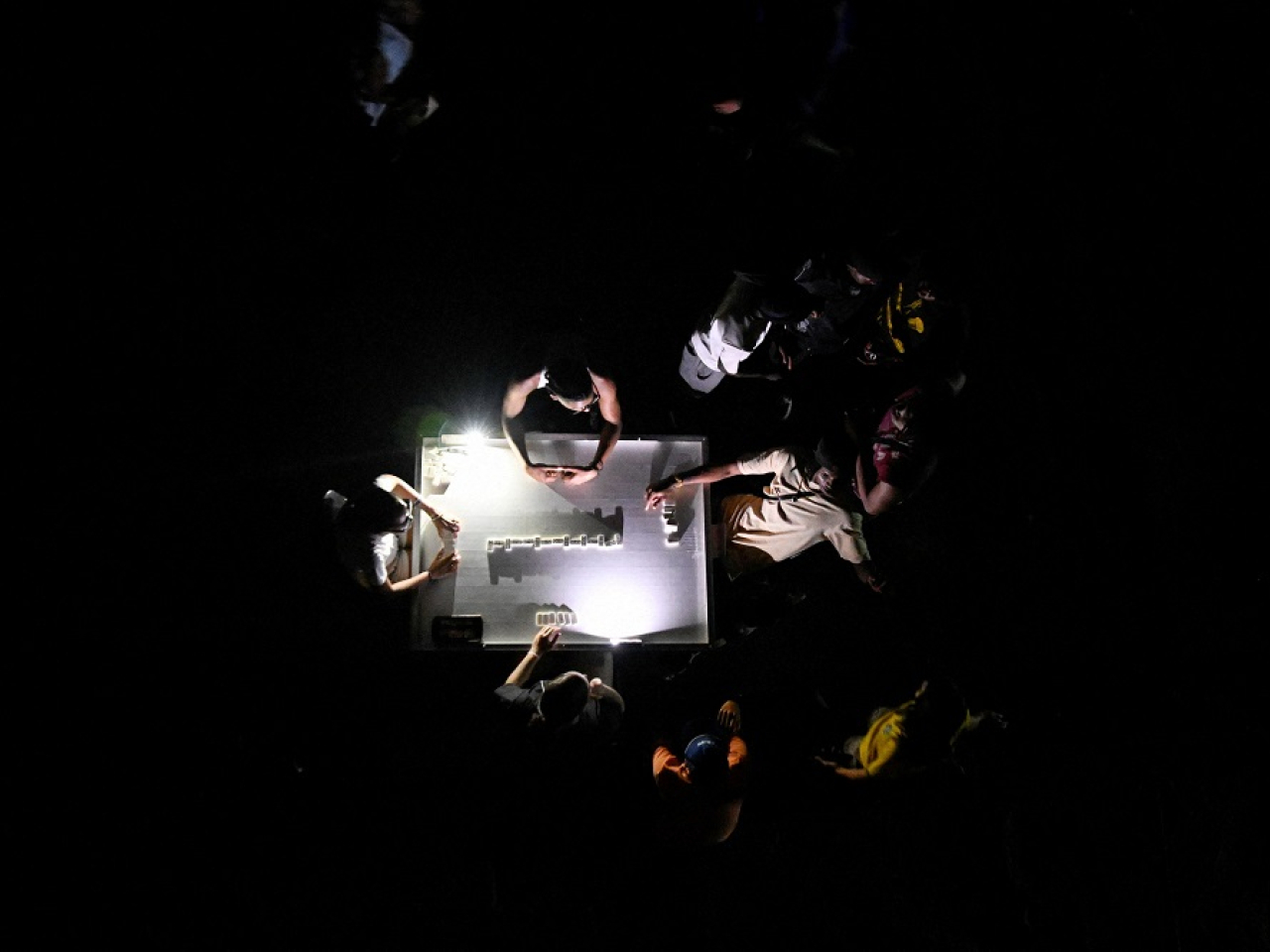 People carry on playing dominoes in Havana during a mass blackout across most of the country. Photo: Reuters