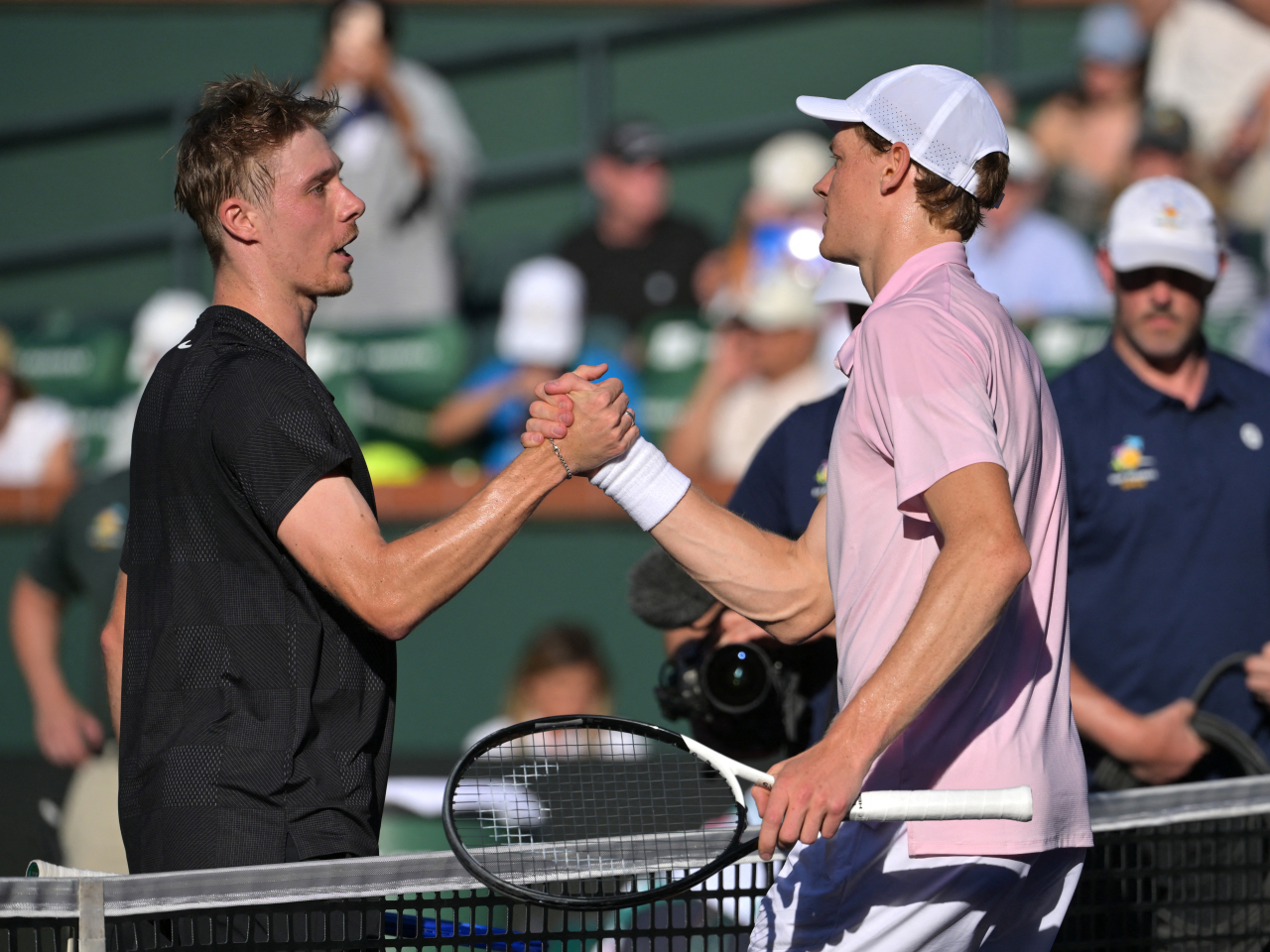 Jannik Sinner, right, cruised into the last 16 after a straight sets win over Canadian Denis Shapovalov. Photo: Reuters