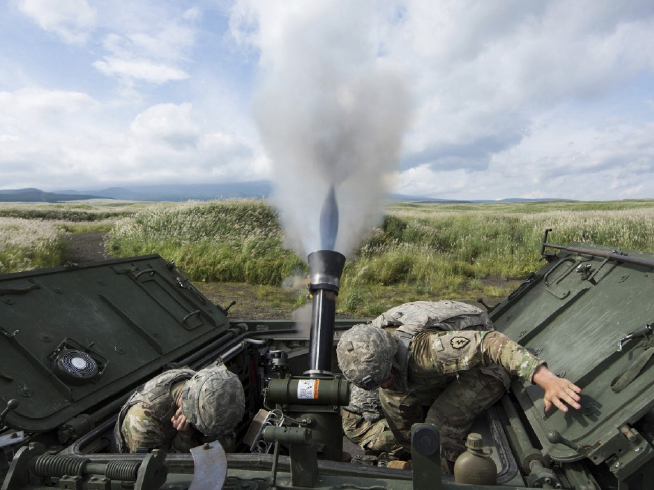 Soldiers conduct a live-fire mortar test at Camp Fuji, where Japan's long-range missiles will also be deployed later this year. File photo: AFP