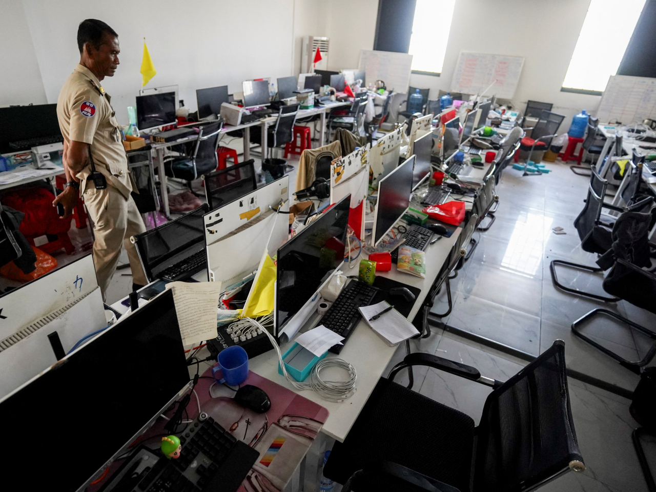 A Cambodian police officer inspects a scam compound operation following a raid in Kampot province. File photo: Reuters