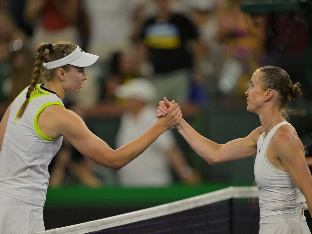 Elena Rybakina, left, shakes hands with Elina Svitolina after winning through to the Indian Wells Open final. File photo: Jayne Kamin-Oncea-Imagn Images via Reuters