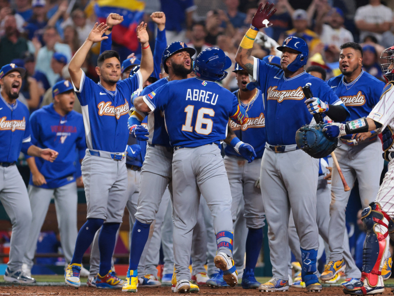 Wilyer Abreu celebrates with his Venezuelan teammates after he slams a three-run home run against Japan. Photo: Sam Navarro-Imagn Images via Reuters