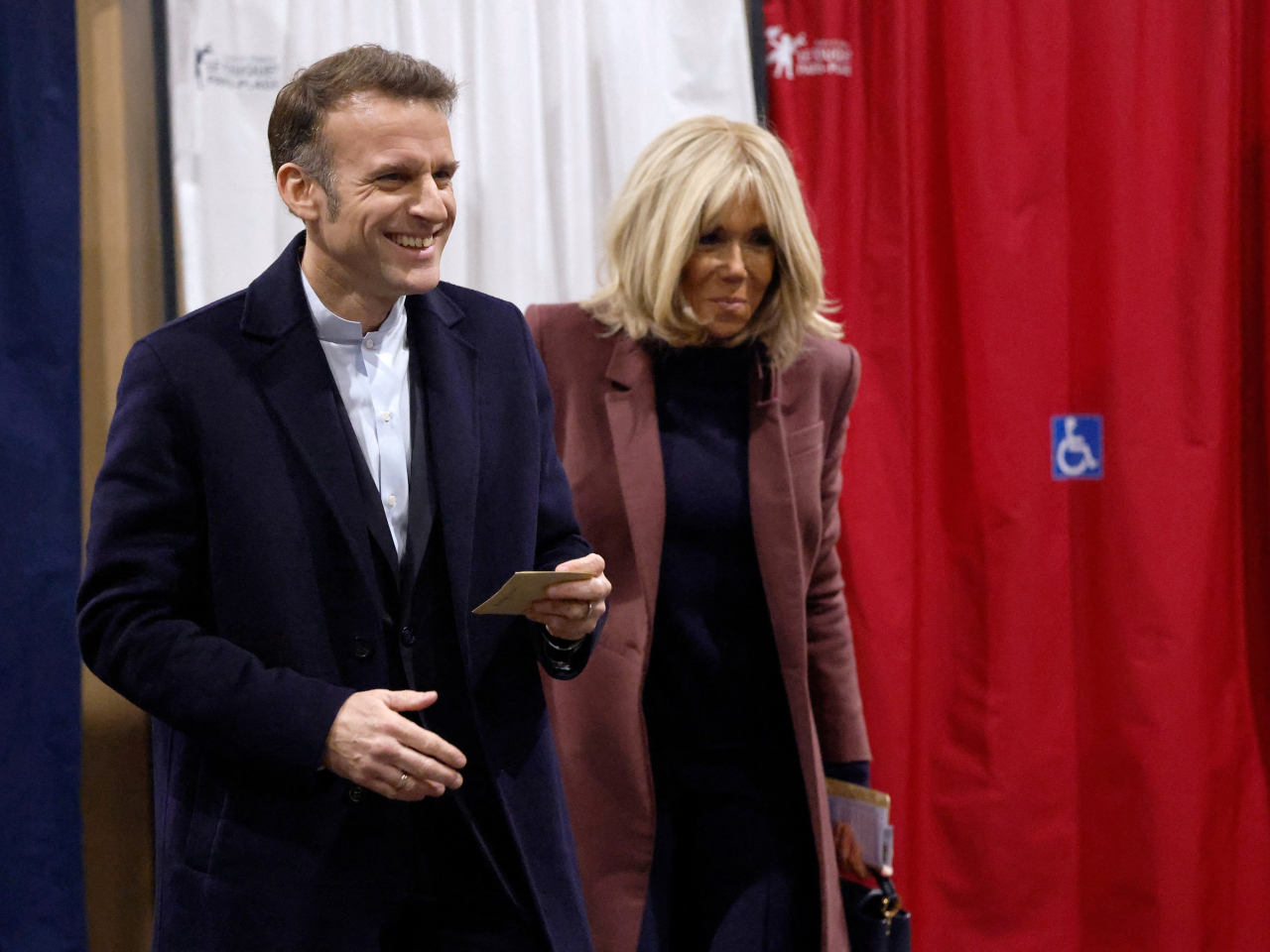 President Emmanuel Macron and his wife Brigitte vote in the French municipal elections. Macron is constitutionally barred from running again in next year's presidential race. Photo: Reuters