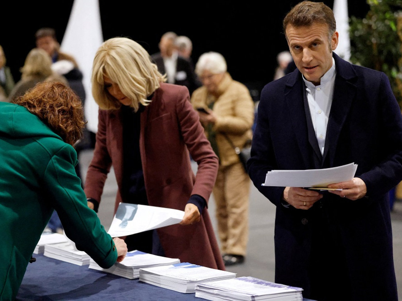 French President Emmanuel Macron and his wife Brigitte Macron attend voting during the first round of France's municipal elections in Le Touquet-Paris-Plage. Photo: Reuters