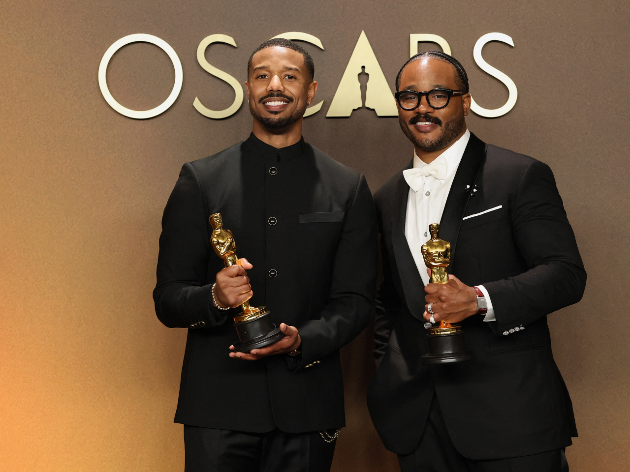 Michael B Jordan and Ryan Coogler with their Oscars for best actor and best original screenplay for 'Sinners'. Photo: Reuters
