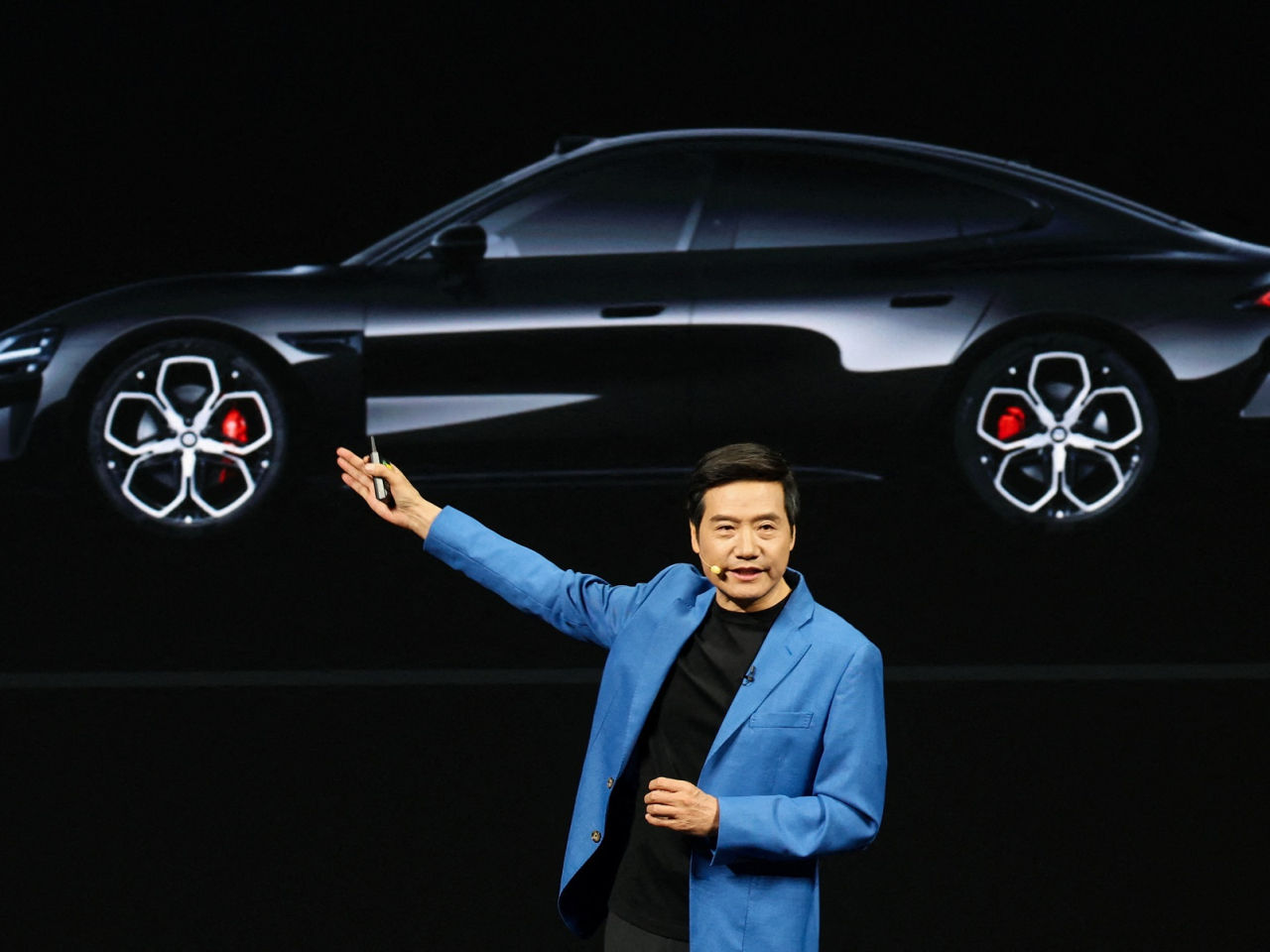 Xiaomi founder Lei Jun speaks at the launch of the new-generation SU7 electric vehicle in Beijing. Photo: Reuters