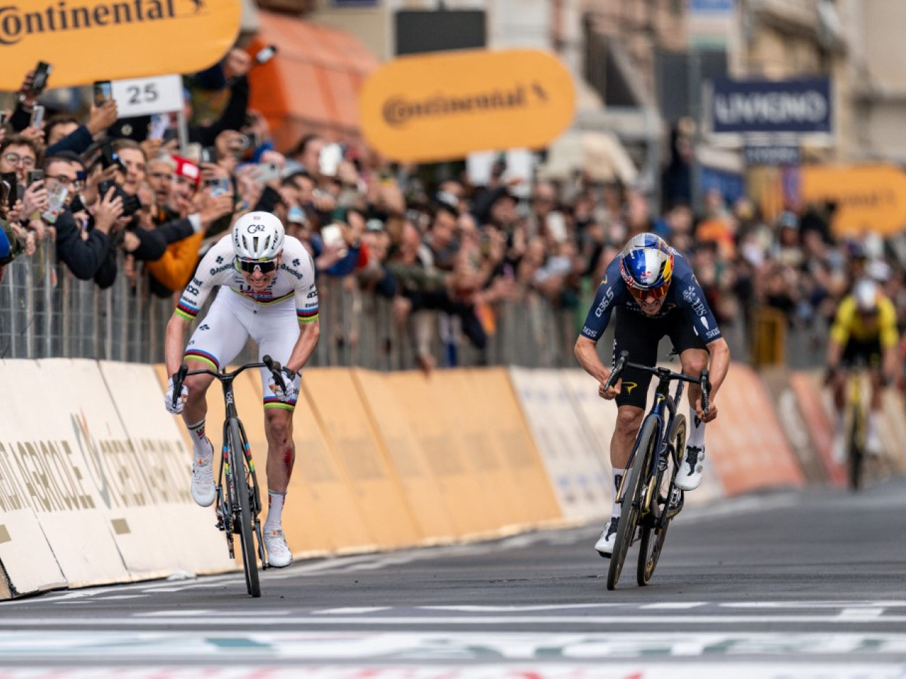 Pogacar (left) pipped Tom Pidcock in an enthralling two-man sprint climax, even after a crash a few kilometres before the key Cipressa climb. Photo: AFP