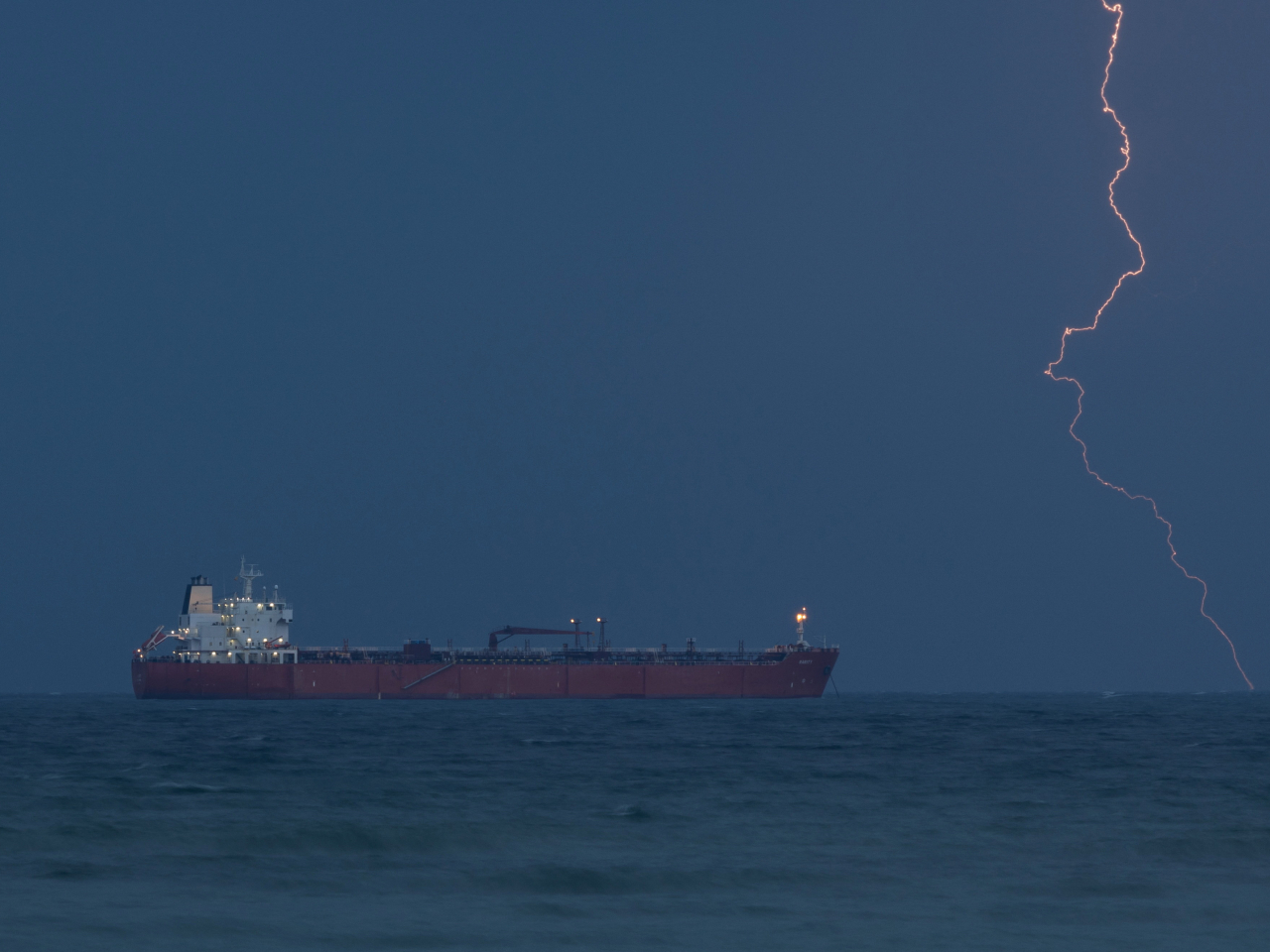 A tanker lies off the coast of Oman near the Strait of Hormuz, which has been effectively closed to shipping since the war began. Photo: Reuters