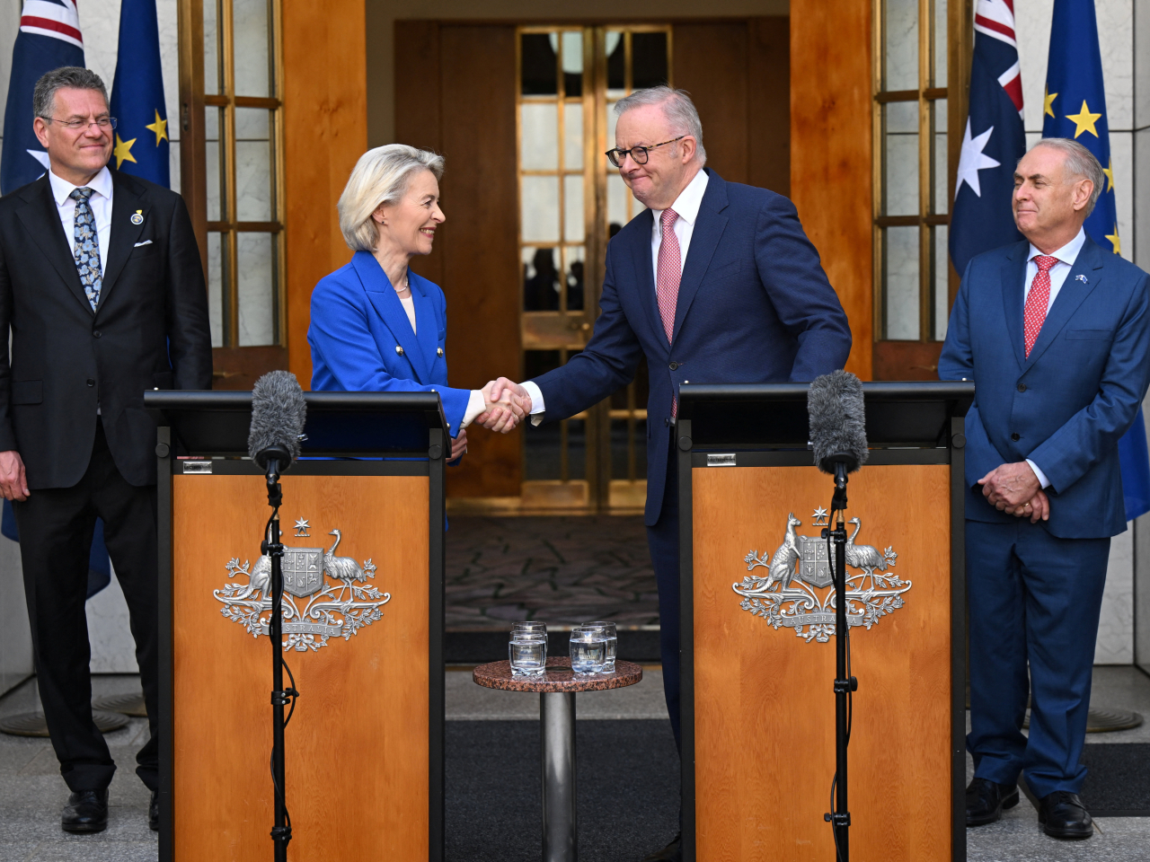 Ursula von der Leyen and Anthony Albanese shake hands at the end of a press conference announcing the free-trade deal in Canberra. Photo: Reuters