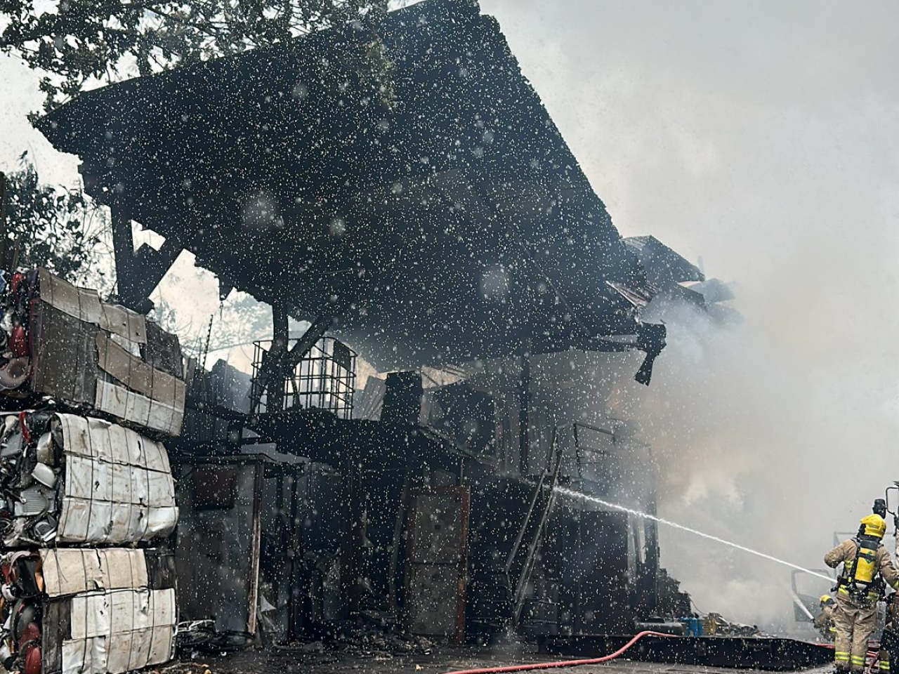 Fire services officials say the blaze started at a scrap metal compactor. Photo: Fire Services Department
