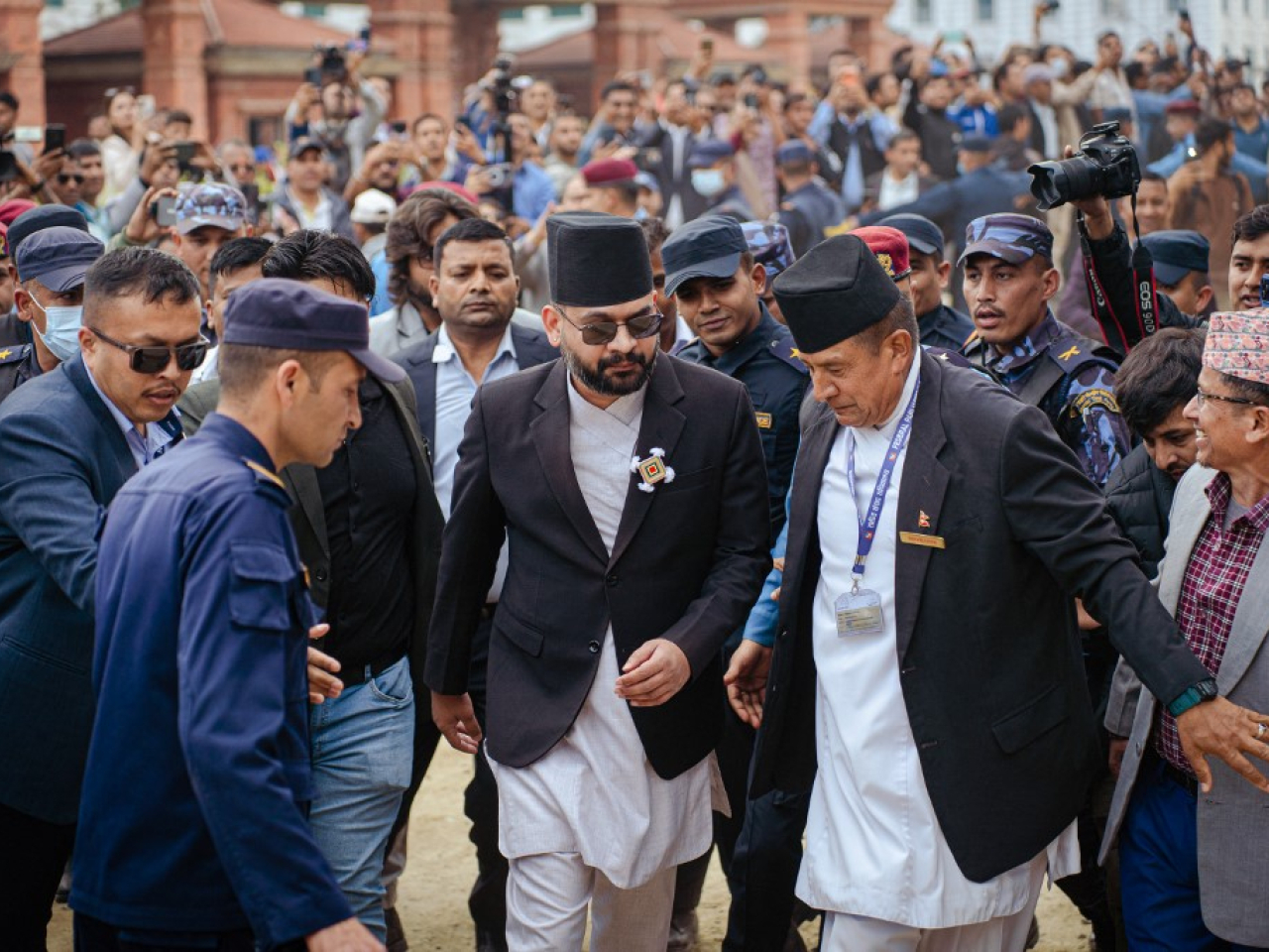 Balendra Shah is ushered into the federal parliament in Kathmandu for his swearing-in as prime minister of Nepal. Photo: AFP