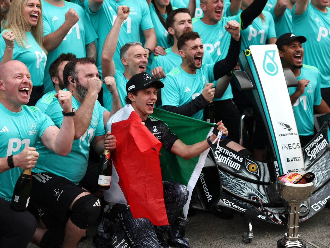 Kimi Antonelli and his Mercedes team celebrate victory at Suzuka. Photo: Reuters