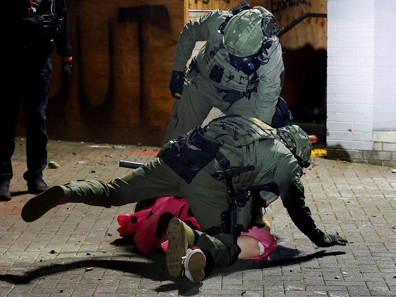Two Border Patrol officers wrestle a 'No Kings' protest activist  to the ground in Portland, Oregon. Photo: Reuters