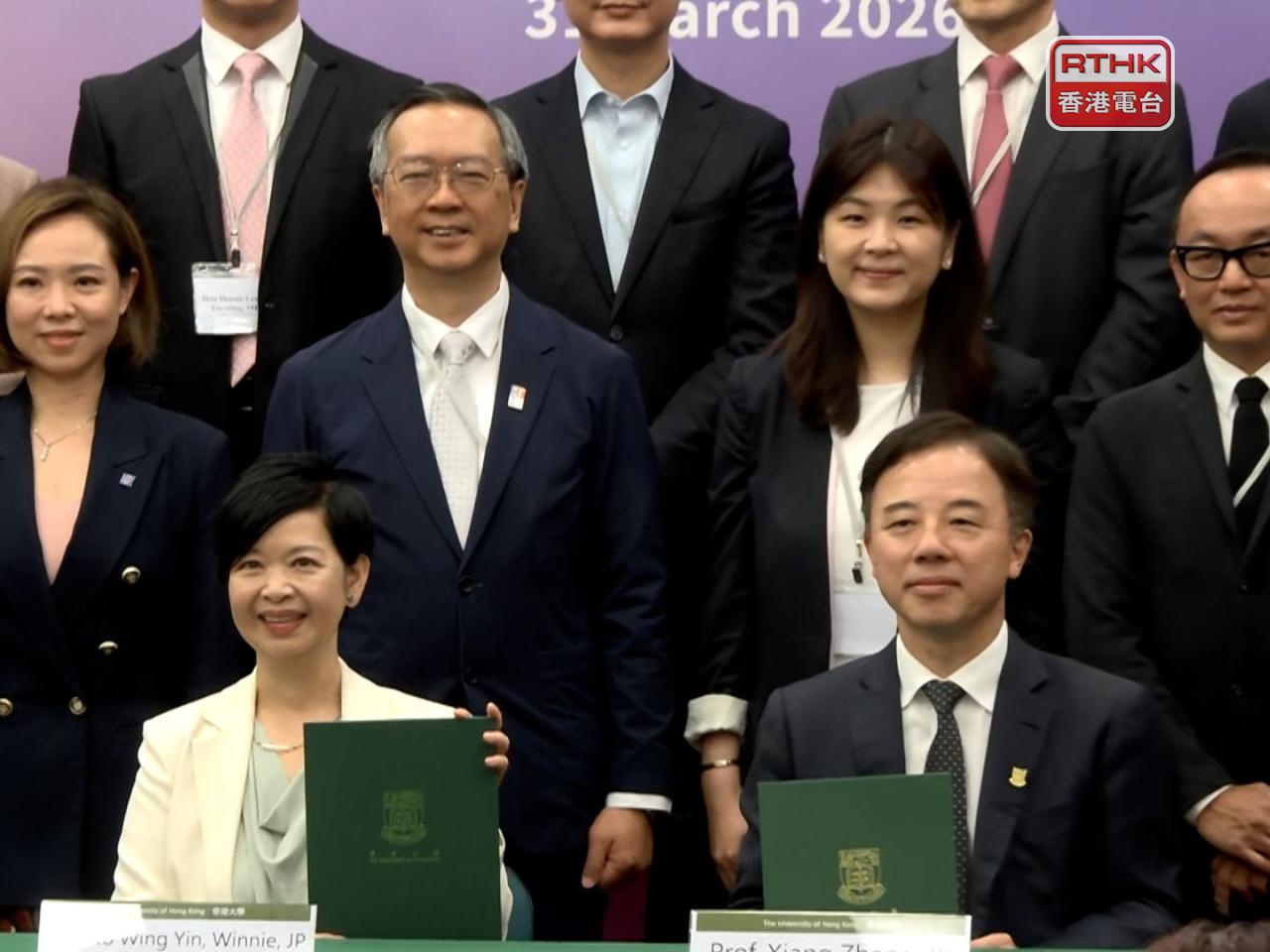 The agreement, signed by Secretary for Housing Winnie Ho and HKU President and Vice-Chancellor Xiang Zhang, aims to accelerate the industry&rsquo;s shift toward high-quality, intelligent and sustainable growth. Photo: RTHK