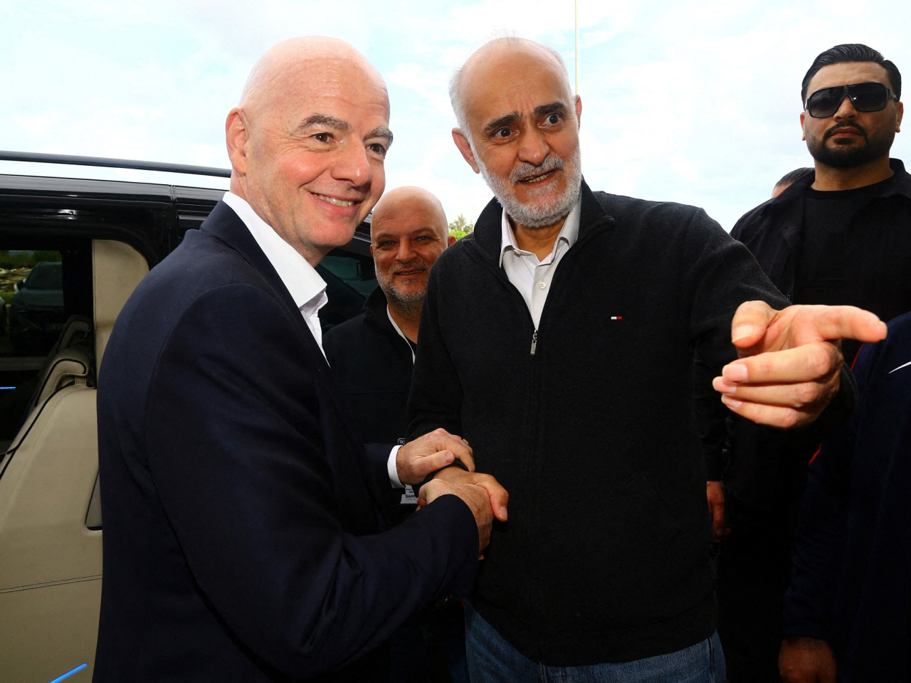Gianni Infantino (left) said Iran's football team will play their group matches as scheduled in the United States despite the US-Israeli war against Iran. Photo: Reuters