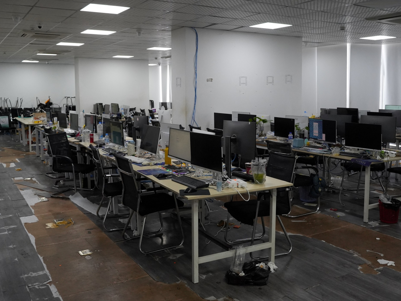 Police seize computers and workstations in an online scam crackdown at a hotel in Phnom Penh last month. Cambodia says it's committed to tackling scam operations. File photo: Reuters